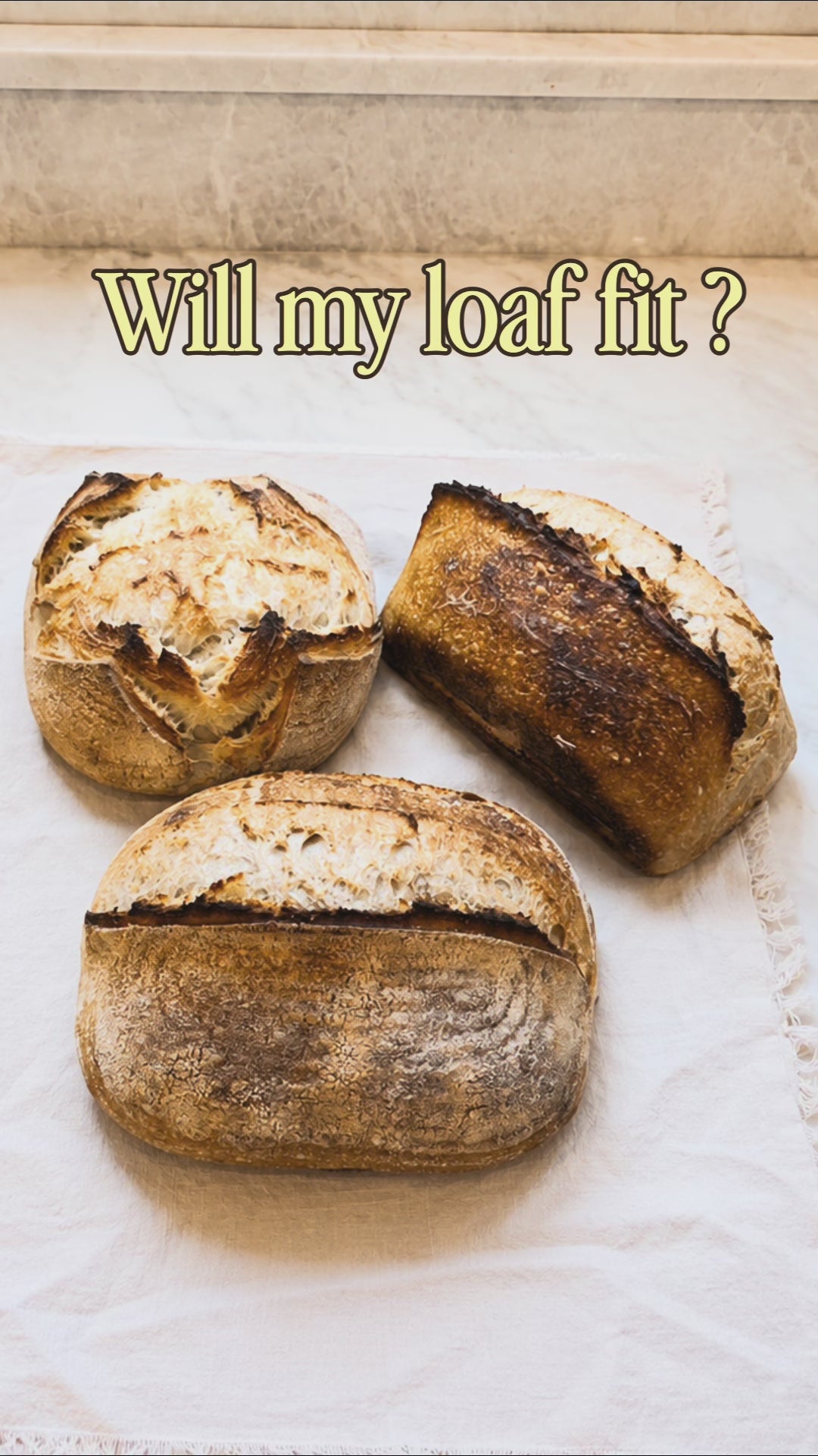 Video comparing how different sourdough loaf shapes fit in the Hearthly bread box, including batard, boule, and loaf. each loaf is sliced and placed inside to show the fit and available space. 